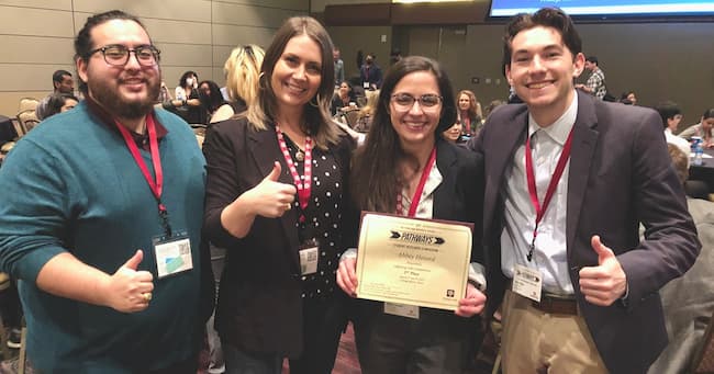 Doctoral students Richard Dally, Vergie Greb, and Nick Diaz pose with Abbey Hotard, class of '23, who earned second place in the Doctoral Lightning Round category at Pathways Research Symposium. 